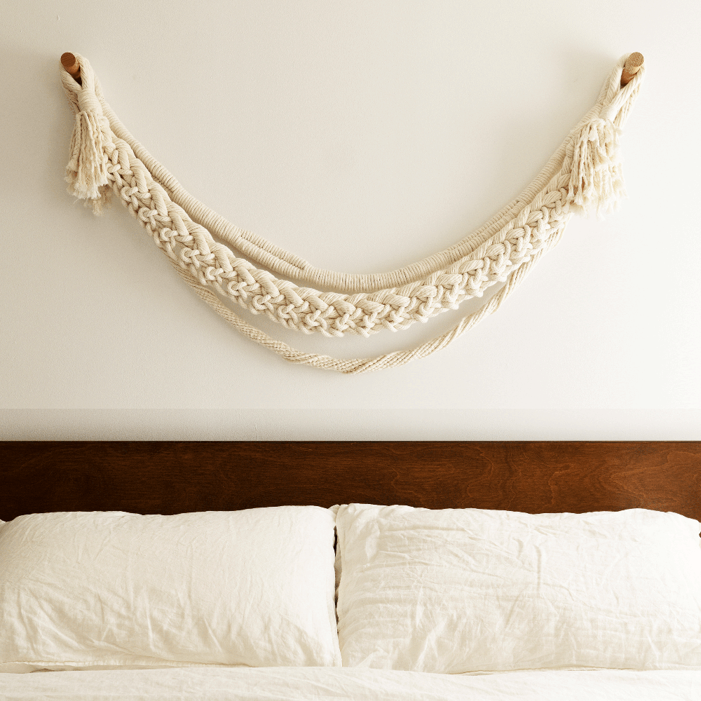 The Tendrils Wall Hanging Hung Above a Bed