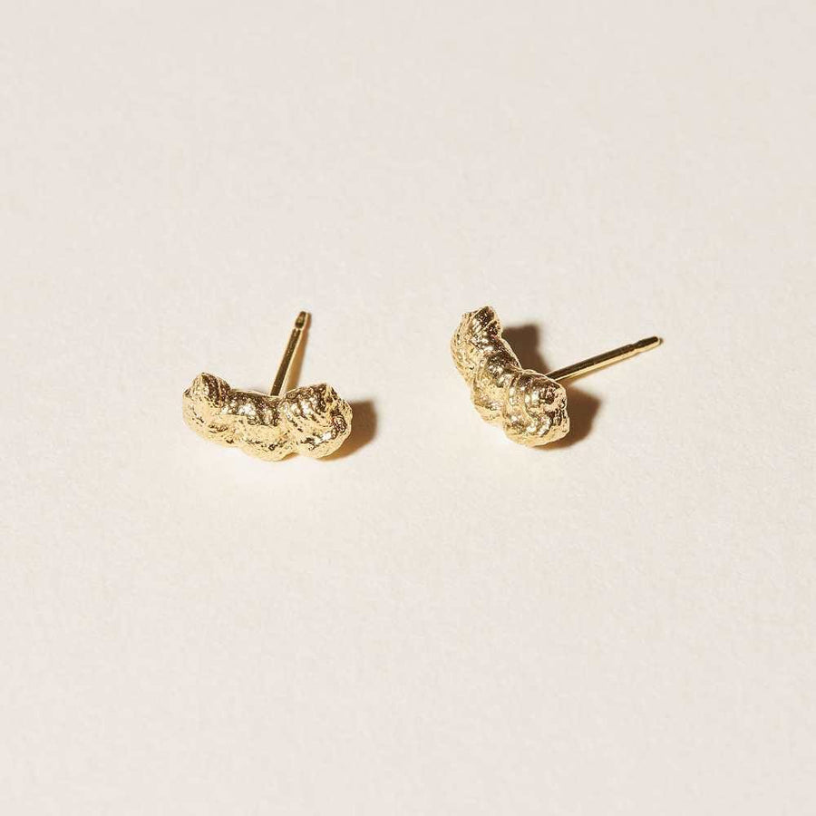 A tiny row of hand tied hitch knots make these a cute but elegant set of golden studs that are sculptural