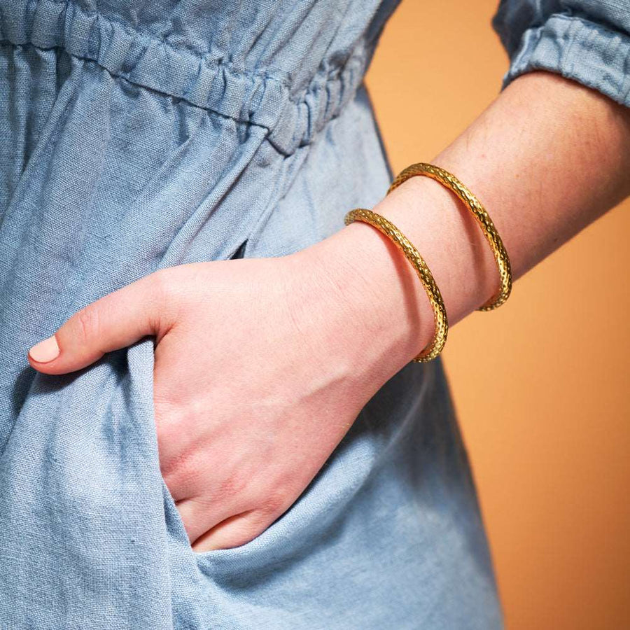 The textured Leeward Cuff seen on a model was cast from a section of cotton clothesline.