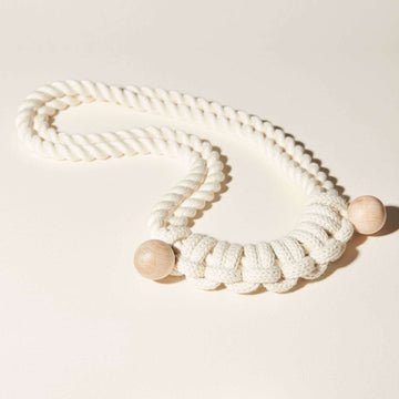 A macramé inspired, 100% cotton necklace with a repeat of hitch knots.