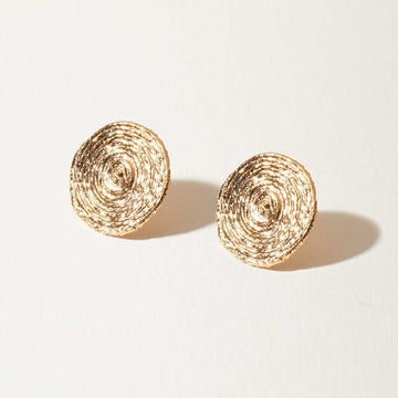 The Orbit Studs are 14k gold earrings of spiraled spheres add a faceted punctuation to your ear lobes.