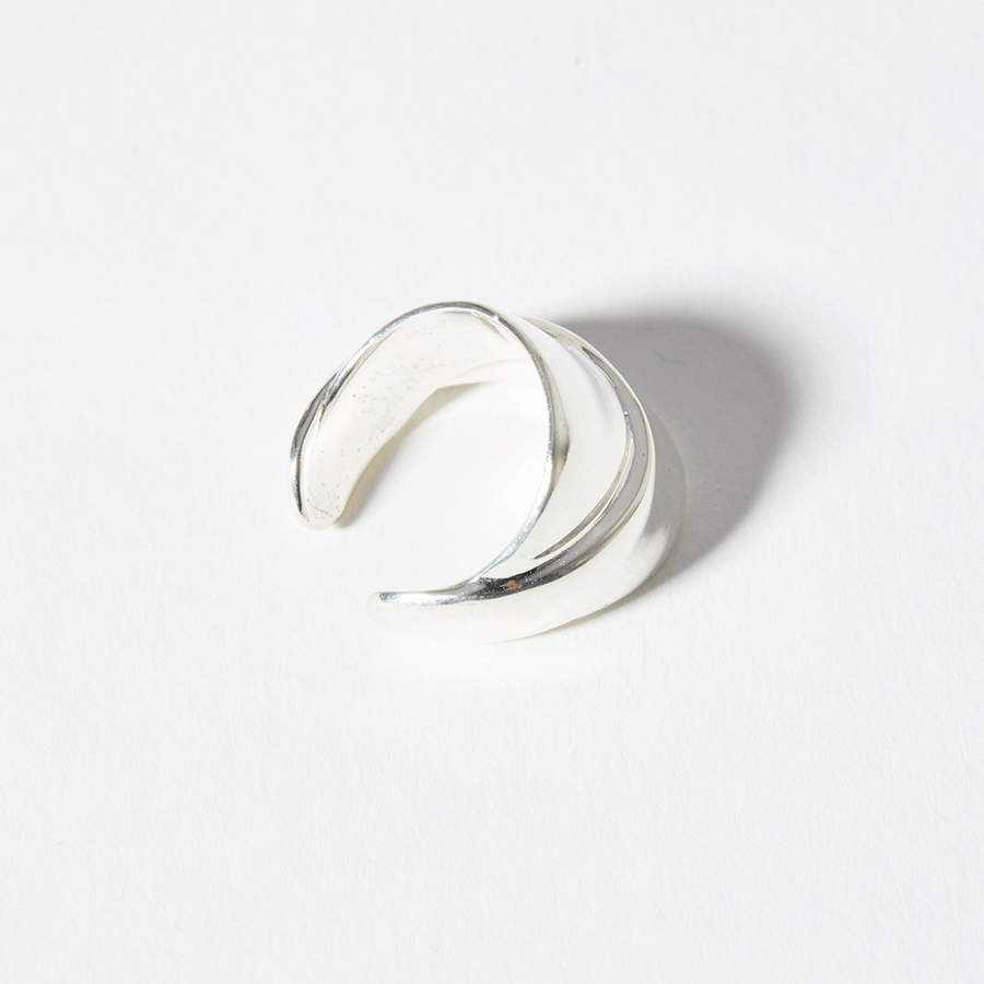 The Strata Ring is highly polished in 925 sterling silver and also in 14k gold plate. Made of two joined bands that slightly overlap