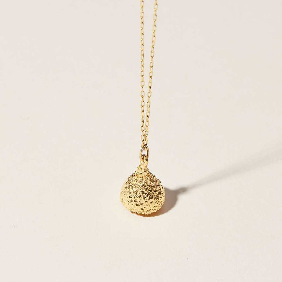 The Talisman Pendant. An acorn is a symbol of strength. This pendant is made of the cap and makes a beautifully textural piece cast in 14k gold. The pendant hangs from a delicate loop chain.
