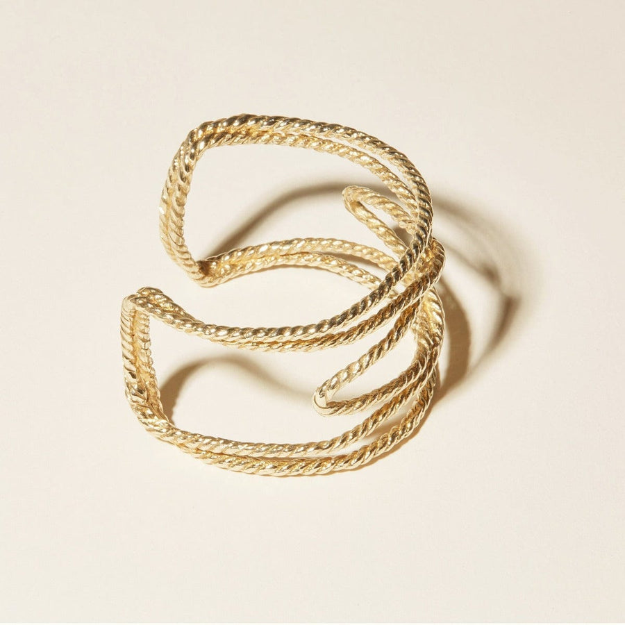 The Windward Cuff is rope-like bracelet that wraps around the wrist with a wide woven profile