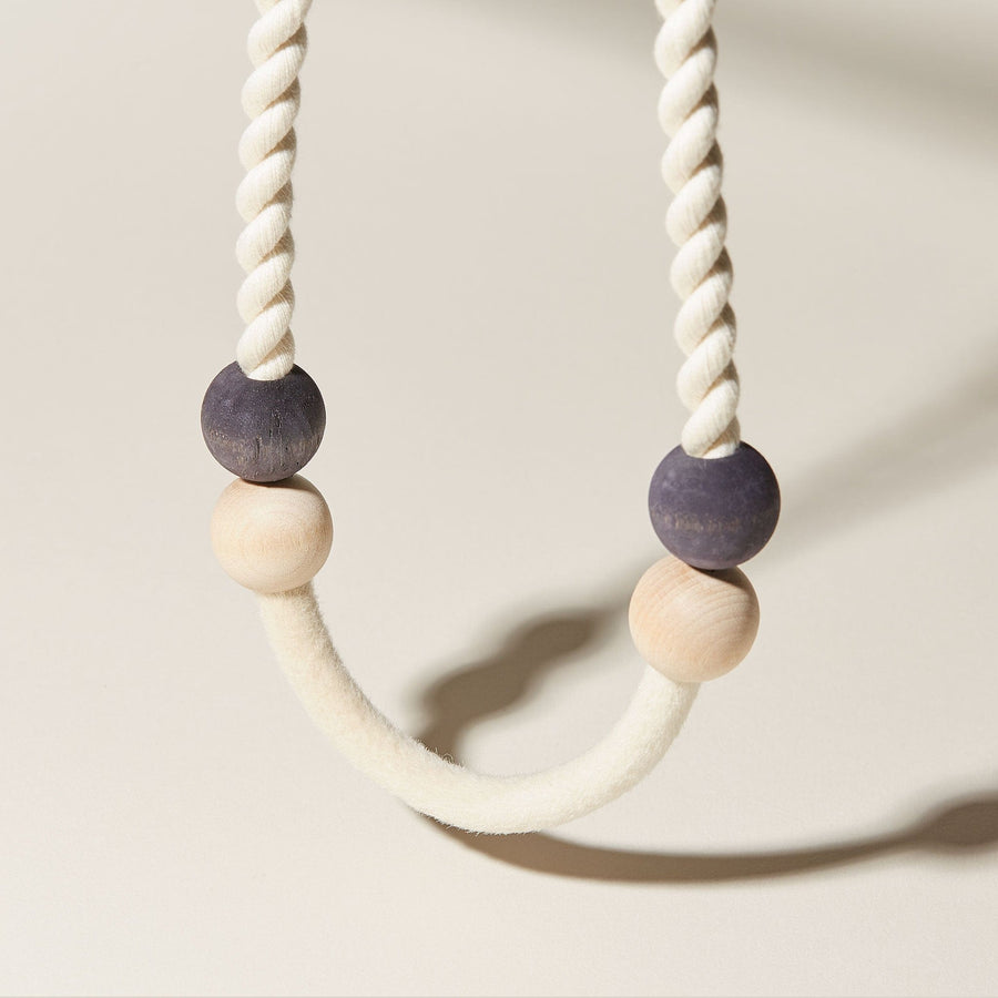 A detail of the soft, summer inspired necklace by COG. Using all natural materials with hand dyed beads in indigo, compressed felted wool. 