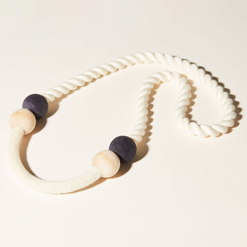 The Port Necklaces combines 3 elements: soft cotton cord, natural and indigo dyed beads, and compressed, felted wool.
