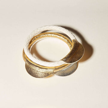 White, silver and gold leather details of the Half-Moon bangles.