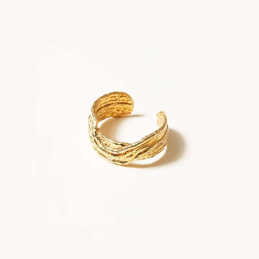 The Tidal Ring from the Cog SAIL Collection. Summer waves inspired this adjustable ring that has been cast in 14K plated gold. 